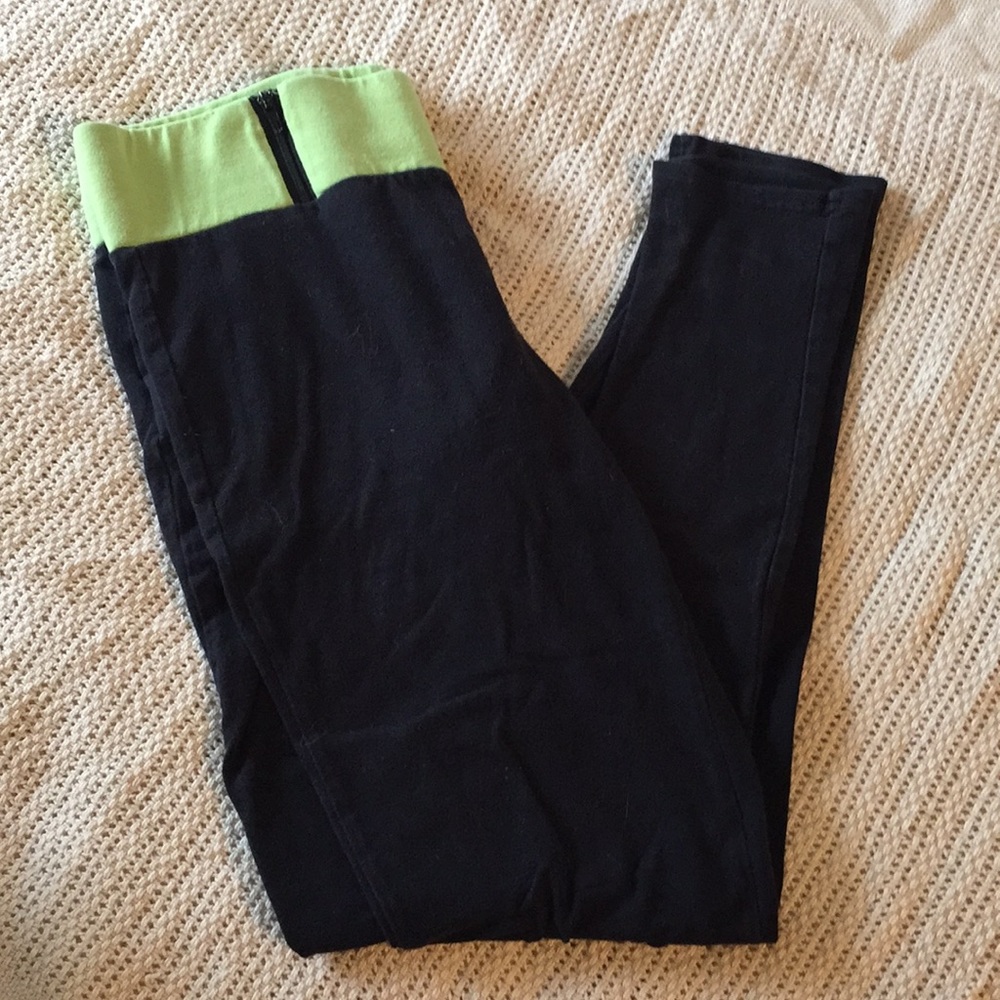 Black yoga pants with green band